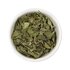 Photo of a small bowl filled with the loose lemon balm Tea from SONNENTOR.