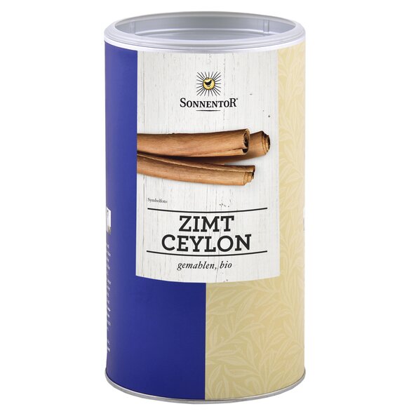 Photo of a big jumbo spice tin cinnamon Ceylon ground. On the tin you can see cinnamon sticks.